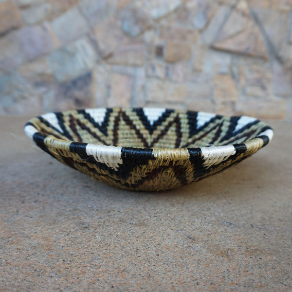 "Handcrafted shallow curved bowl showcasing rustic charm and timeless elegance, perfect for fruits, snacks, or decor."