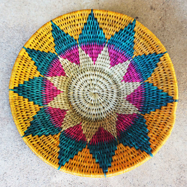 "Handwoven Lavumisa baskets showcasing intricate patterns and vibrant colors, perfect for adding a touch of cultural flair to your home decor."