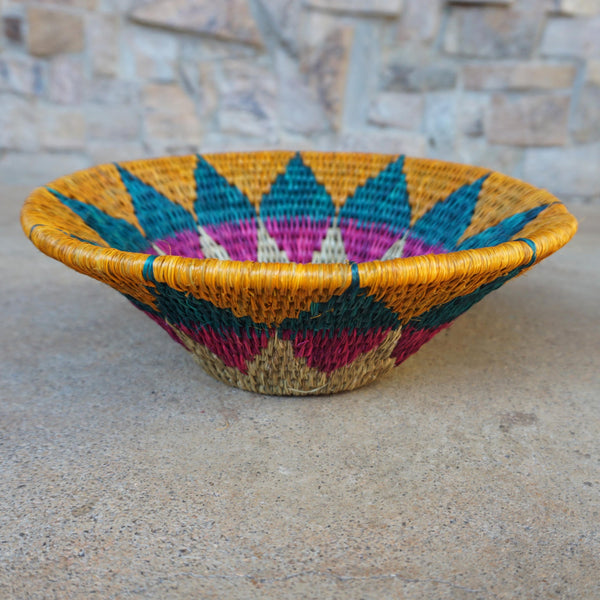 "Handwoven Lavumisa baskets showcasing intricate patterns and vibrant colors, perfect for adding a touch of cultural flair to your home decor."