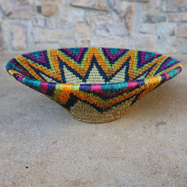 "Handwoven Lavumisa baskets showcasing intricate patterns and vibrant colors, perfect for adding a touch of cultural flair to your home decor."