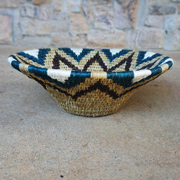 "Handwoven Lavumisa baskets showcasing intricate patterns and vibrant colors, perfect for adding a touch of cultural flair to your home decor."