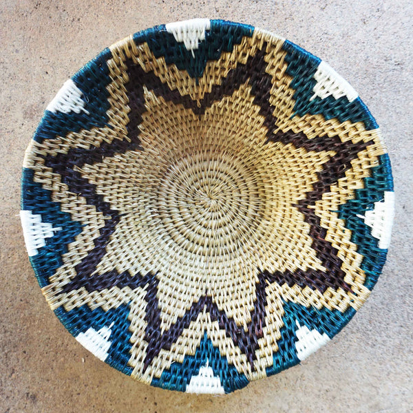 "Handwoven Lavumisa baskets showcasing intricate patterns and vibrant colors, perfect for adding a touch of cultural flair to your home decor."