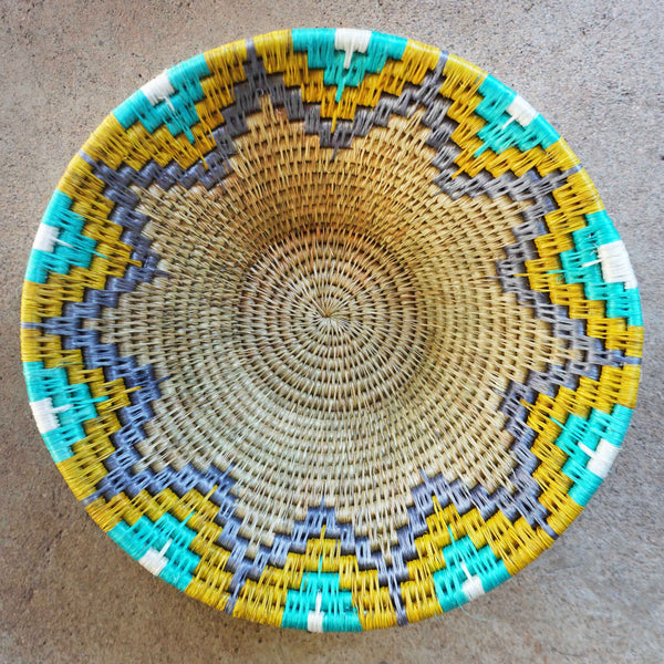 "Handwoven Lavumisa baskets showcasing intricate patterns and vibrant colors, perfect for adding a touch of cultural flair to your home decor."