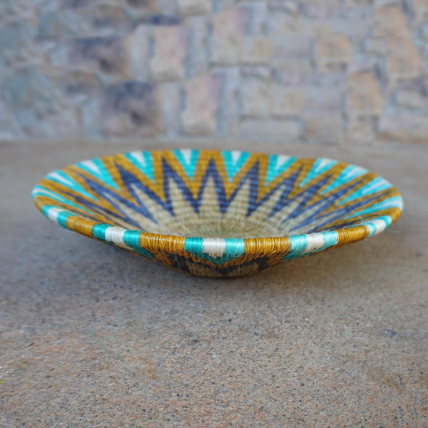 "Handcrafted shallow curved bowl showcasing rustic charm and timeless elegance, perfect for fruits, snacks, or decor."