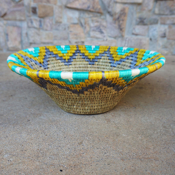 "Handwoven Lavumisa baskets showcasing intricate patterns and vibrant colors, perfect for adding a touch of cultural flair to your home decor."