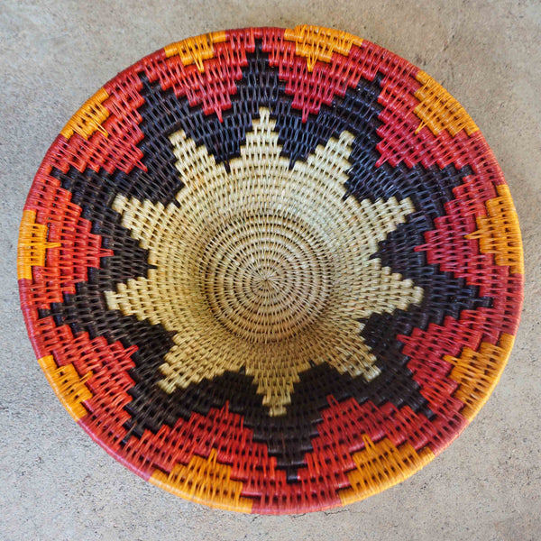 "Handwoven Lavumisa baskets showcasing intricate patterns and vibrant colors, perfect for adding a touch of cultural flair to your home decor."